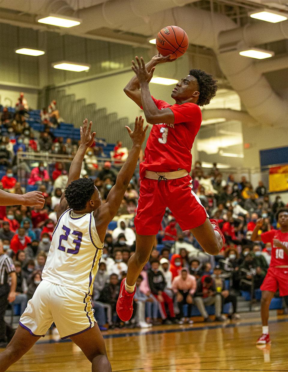 Butler's Mershon Dickerson (3) dropped in a floater against the Male defense during the boys LIT final Saturday night at Valley High School. The Male Bulldogs defeated the Butler Bears 96-84 to win the 2022 Boys LIT Championship. January 15, 2022