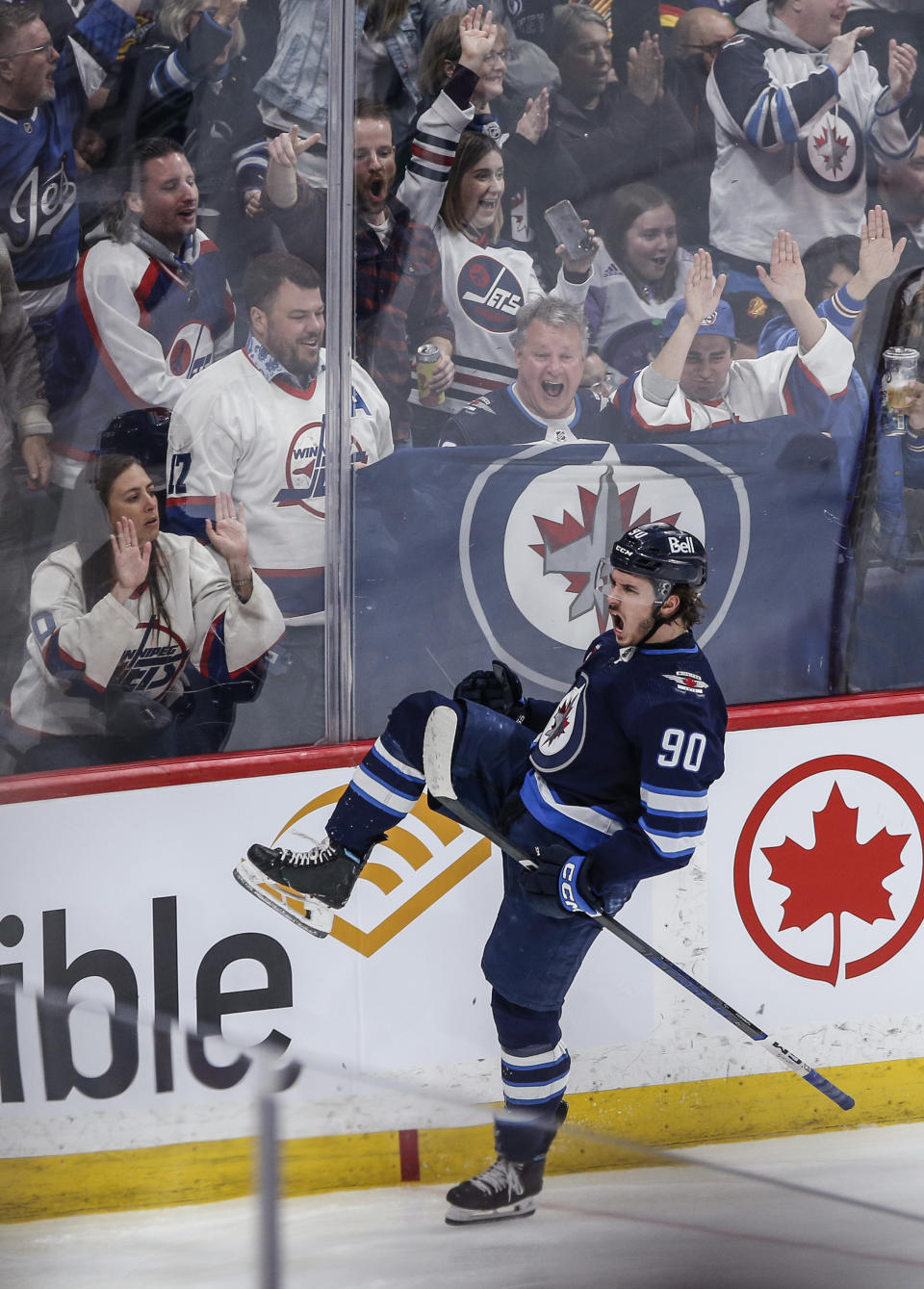 Winnipeg Jets' Nikita Chibrikov (90) celebrates his goal against the Vancouver Canucks during the third period of an NHL hockey game Thursday, April 18, 2024, in Winnipeg, Manitoba. (John Woods/The Canadian Press via AP)