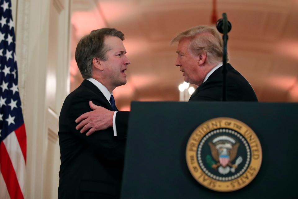 President Donald Trump shakes hands with federal appeals court Judge Brett Kavanaugh, his Supreme Court nominee, in the East Room of the White House last July.