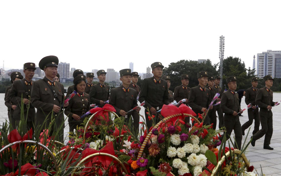 Korean People's Army (KPA) service personnel visit the statues of their late leaders Kim Il Sung and Kim Jong Il on Mansu Hill on the occasion of the 62nd anniversary of Kim Jong Il's first field guidance for the revolutionary armed forces in Pyongyang, North Korea Thursday, Aug. 25, 2022. (AP Photo/Jon Chol Jin)