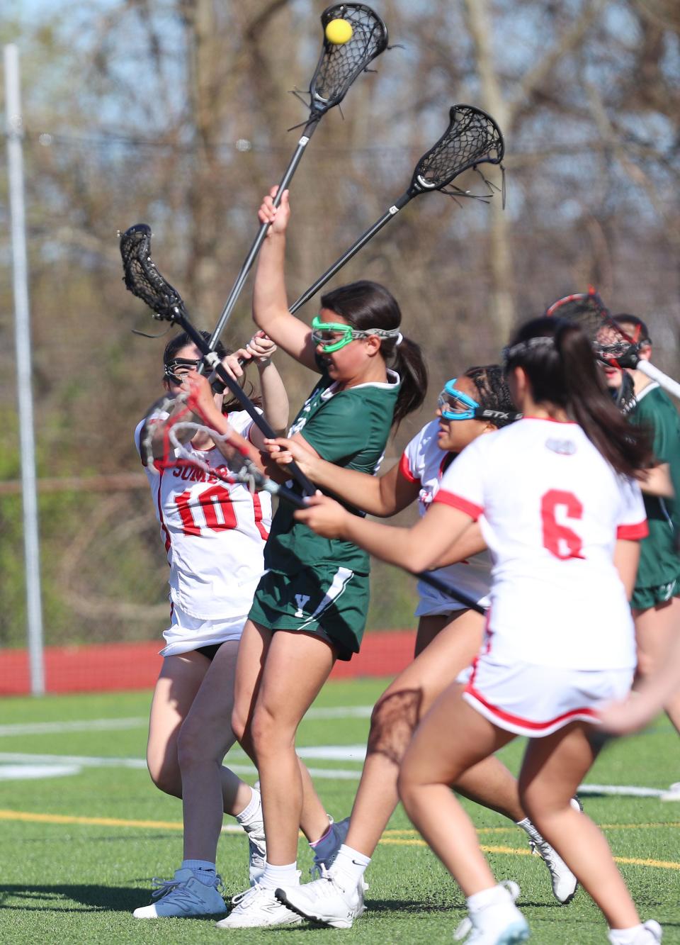 YorktownÕs Lily Diaz (13) fires a shot on goal against Somers during girls lacrosse action at Somers High School April 25, 2024. Yorktown won the game 8-5.