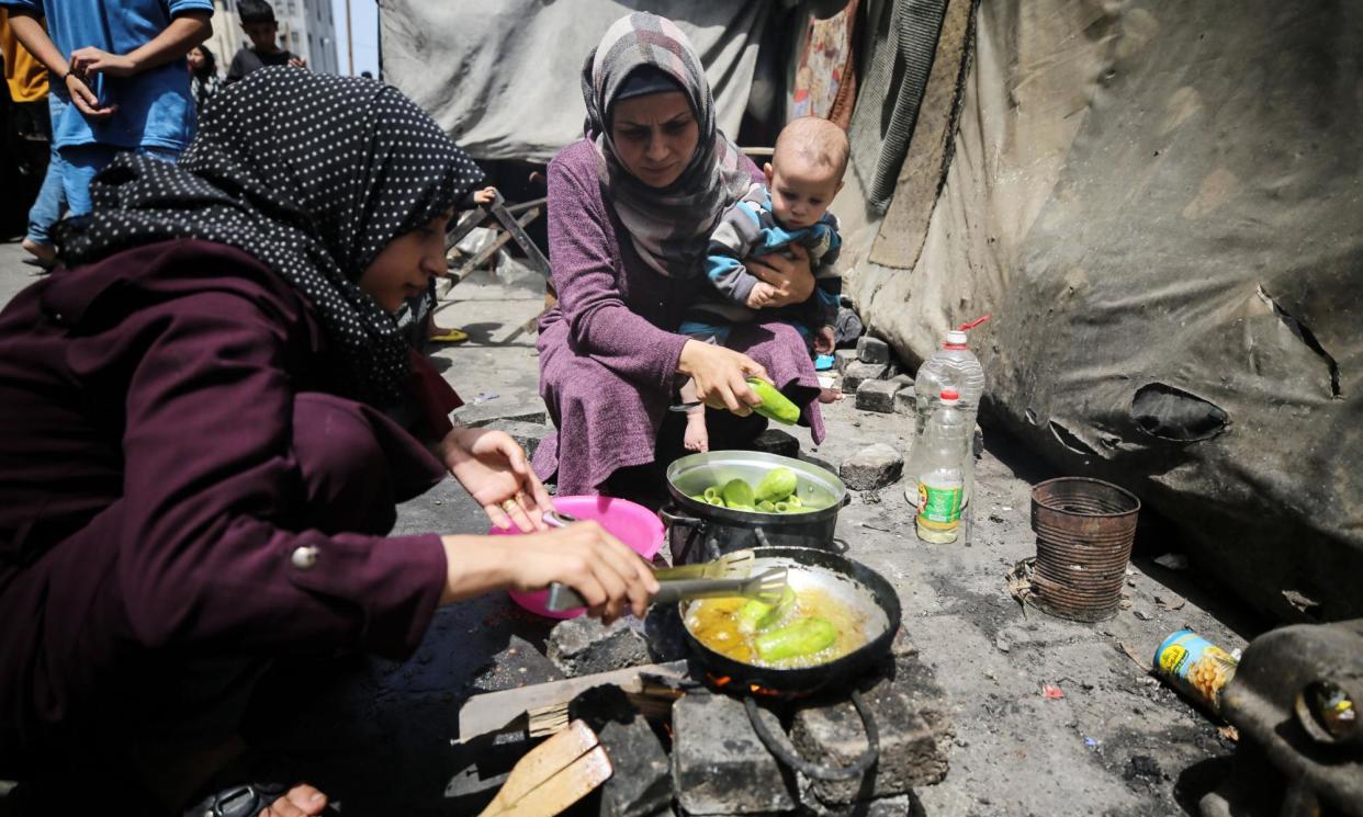 <span>Displaced Palestinians sheltering in a Unrwa-affiliated school in Deir al-Balah, in the central Gaza Strip, after fleeing Israeli airstrikes.</span><span>Photograph: Majdi Fathi/NurPhoto/Rex/Shutterstock</span>