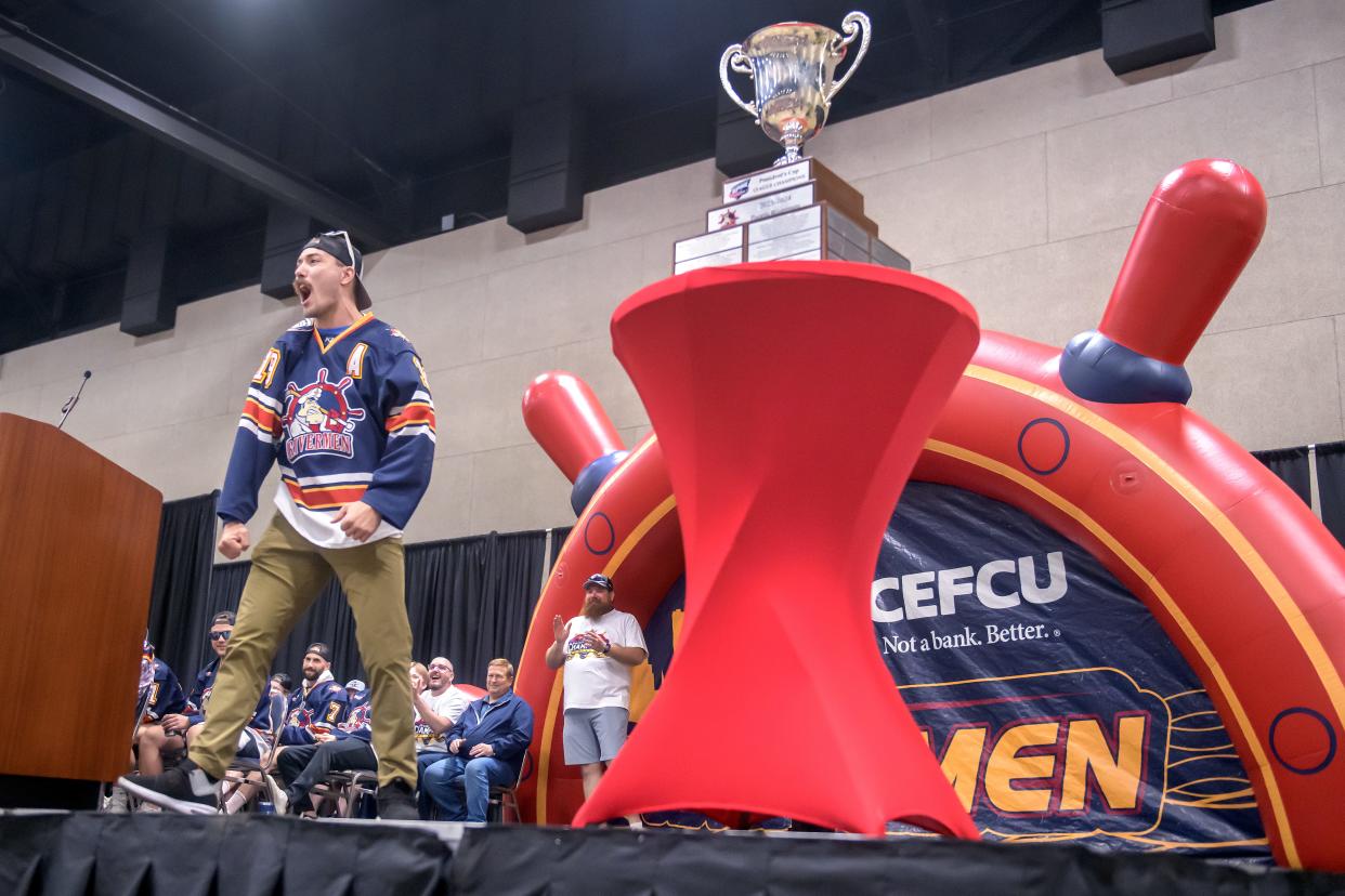 Peoria Rivermen defenseman Zach Wilkie whips the crowd up with a rendition of "We Are the Champions" during the team's public celebration of their SPHL President's Cup championship Friday, May 3, 2024 at the Peoria Civic Center.