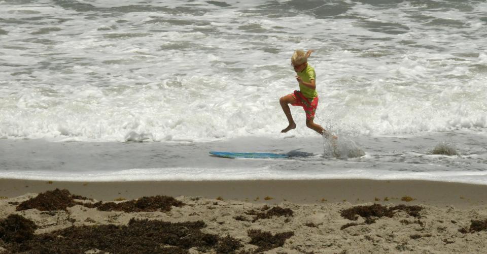 Beachgoers on a windy Monday afternoon with   Hightower Beach Park in Satellite Beach. The rough waves kept most surfers out of the water.