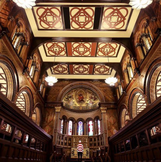 Wally almost starts to blend in with this ornate church.