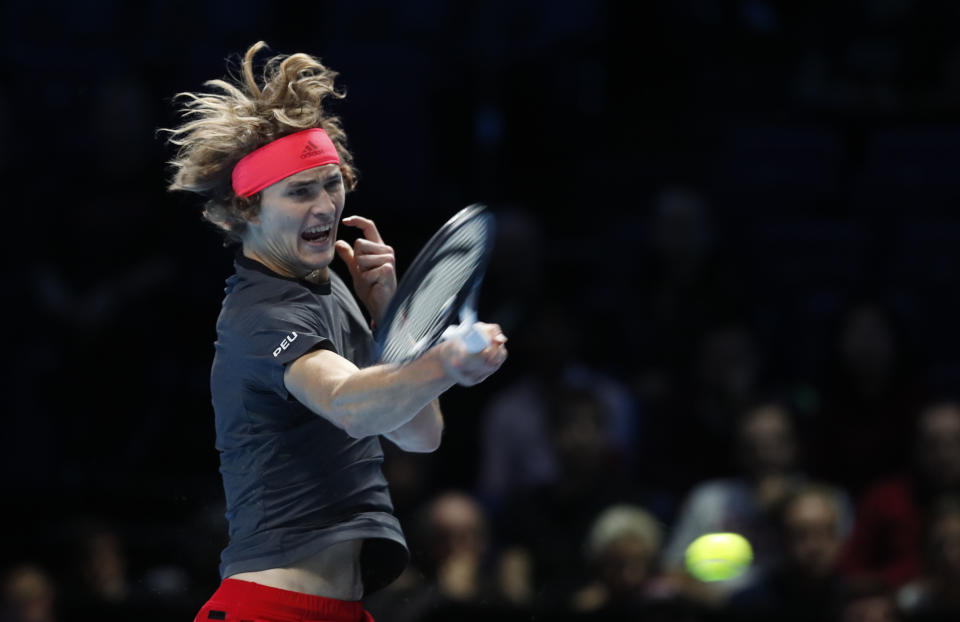 Alexander Zverev of Germany plays a return to Novak Djokovic of Serbia during their ATP World Tour Finals men's singles tennis match at the O2 arena in London, Wednesday, Nov. 14, 2018. (AP Photo/Alastair Grant)