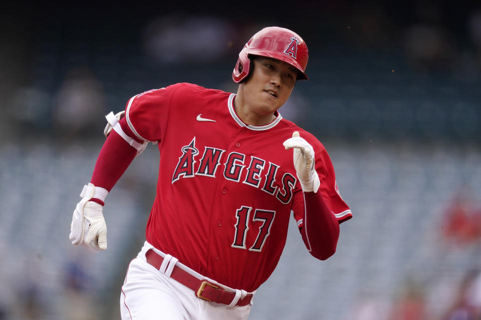 Los Angeles Angels' Shohei Ohtani runs to third after hitting a triple during the first inning of a baseball game against the Texas Rangers Sunday, July 31, 2022, in Anaheim, Calif. (AP Photo/Mark J. Terrill)