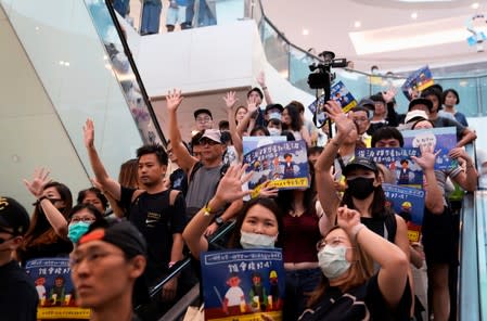 Anti-government protesters hold a rally in a shopping mall in Sha Tin, Hong Kong, China