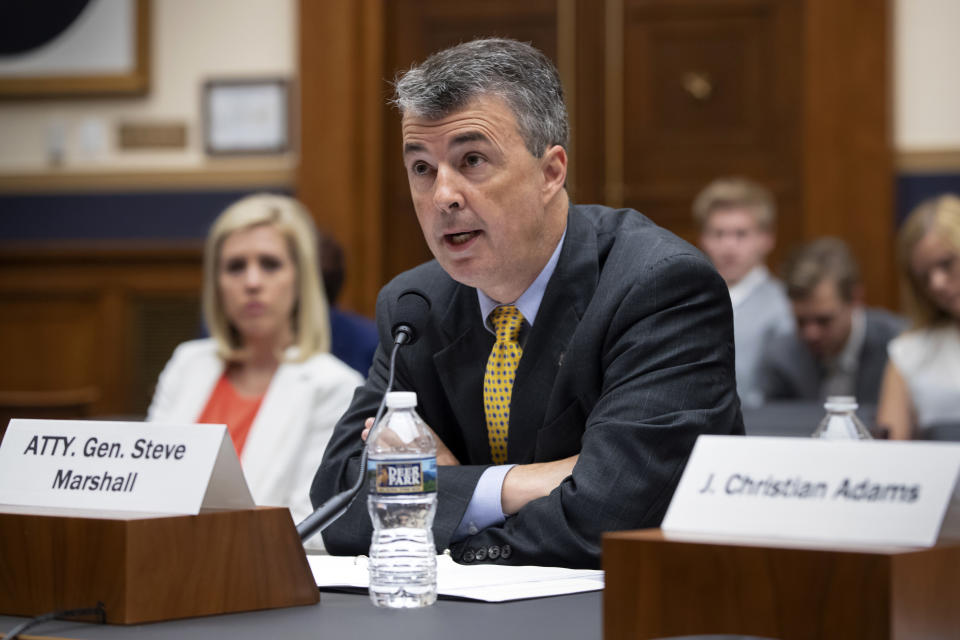 FILE - In this June 8, 2018, file photo, Alabama Attorney General Steve Marshall addresses the House Judiciary Subcommittee on the Constitution and Civil Justice on Capitol Hill in Washington. Marshall says his office is reviewing whether deceptive social media tactics used in last year’s U.S. Senate race might have violated the law. (AP Photo/J. Scott Applewhite, File)