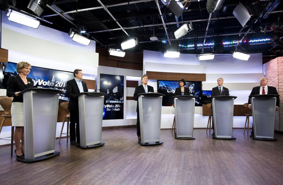 Karen Stintz, left to right, John Tory, moderator Gord Martineau, Olivia Chow, David Soknacki and Rob Ford take part in the first debate for the Toronto mayoral race in Toronto on Wednesday, March 26, 2014. (AP Photo/The Canadian Press, Nathan Denette)