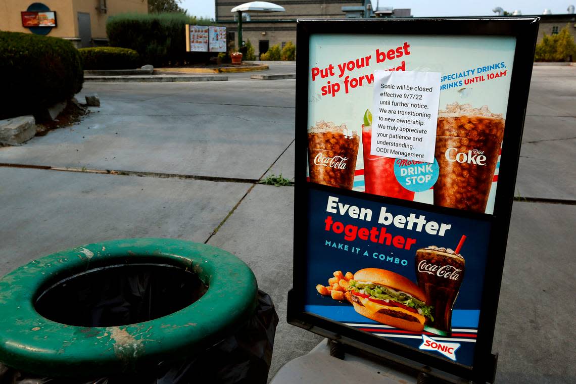 The entry to the Sonic Drive-In fast food restaurant off Gage Boulevard in Kennewick is blocked by garbage cans and a sign with a typed note announcing the closure of the business starting on Sept. 7.