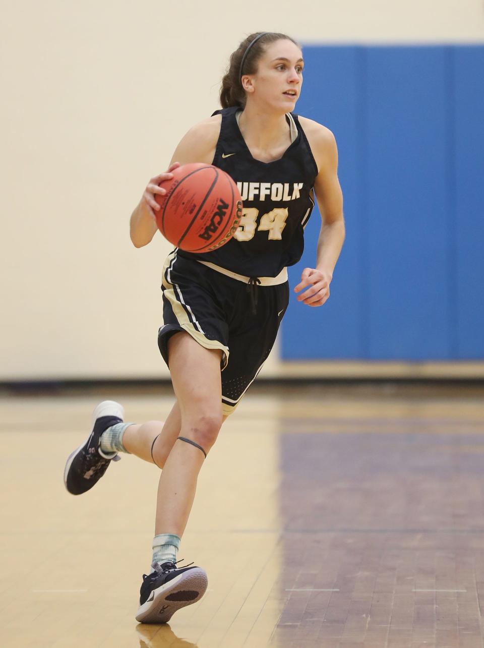 Gabriella DeComo of Portsmouth is in her final season with the Suffolk women's basketball team.