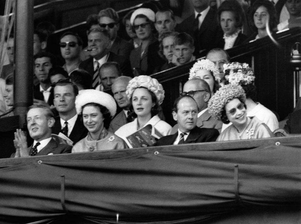 <p>The Queen and Princess Margaret cheer from the Royal Box.</p>