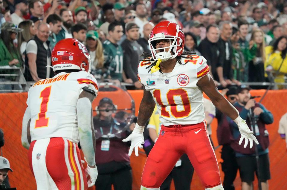 Kansas City Chiefs running back Isiah Pacheco (10) celebrates with running back Jerick McKinnon (1) after scoring a touchdown against the Philadelphia Eagles during the second half in Super Bowl LVII at State Farm Stadium.