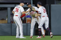Minnesota Twins outfielders Matt Wallner, Michael A. Taylor and Max Kepler, from left, celebrate the team's win over the Detroit Tigers in a baseball game Tuesday, Aug. 15, 2023, in Minneapolis. (AP Photo/Bruce Kluckhohn)