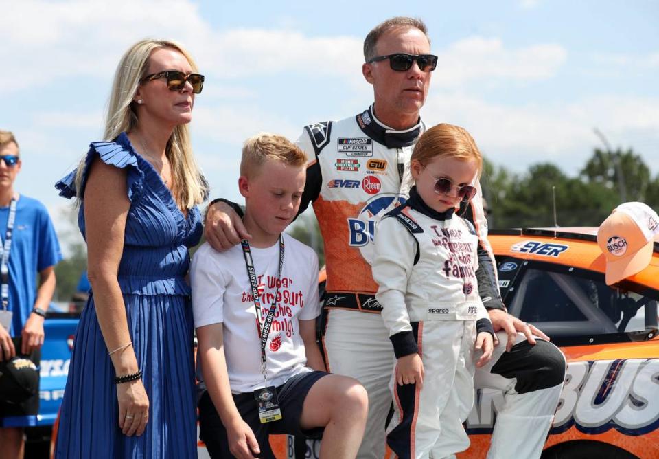 Jul 23, 2023; Long Pond, Pennsylvania, USA; NASCAR Cup Series driver Kevin Harvick stands with his wife DeLana Harvick and son Keelan and daughter Piper prior to the HighPoint.com 400 at Pocono Raceway. Matthew O'Haren/Matthew O'Haren-USA TODAY Sports