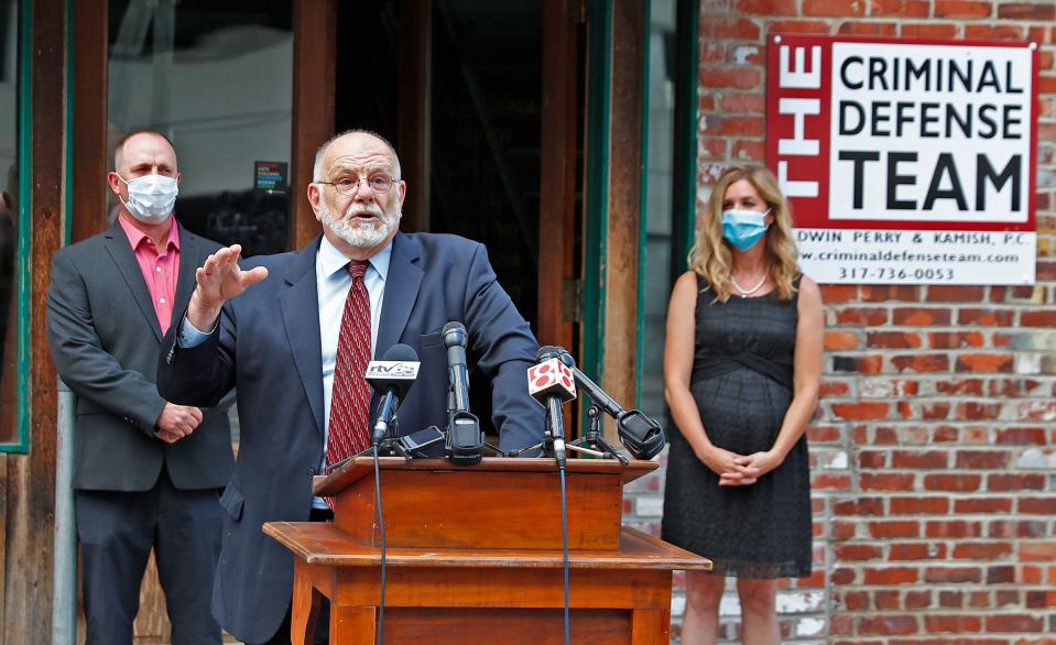 Attorney David Hennessy speaks outside The Criminal Defense offices, Monday, July 13, 2020, about the July 4 incident at Lake Monroe in which Sean Purdy, left, and Caroline McCord, right, are accused of a racial attack on Vauhxx Booker. Attorneys representing Purdy and McCord say that Booker instigated violence and threw punches first.