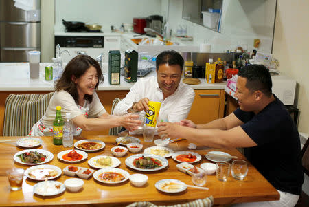 Hong Ryong Su, an ethic Korean in Japan, has a dinner with his ethnic Korean wife and an ethnic Korean friend who works for the General Association of Korean Residents in Japan (Chongryon), at his house in Tokyo, Japan, June 3, 2018. REUTERS/Kim Kyung-Hoon