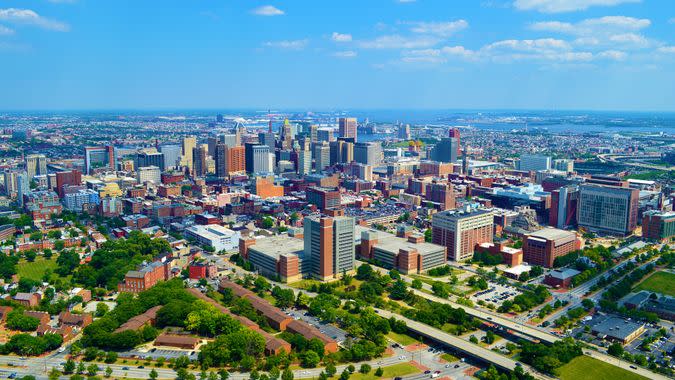 This photo was taken of Baltimore, MD while flying a helicopter at an altitude of 1000 feet above ground level and passing the city on June 12, 2017 while on a photo mission from a promotions company for twelve golfing resorts.