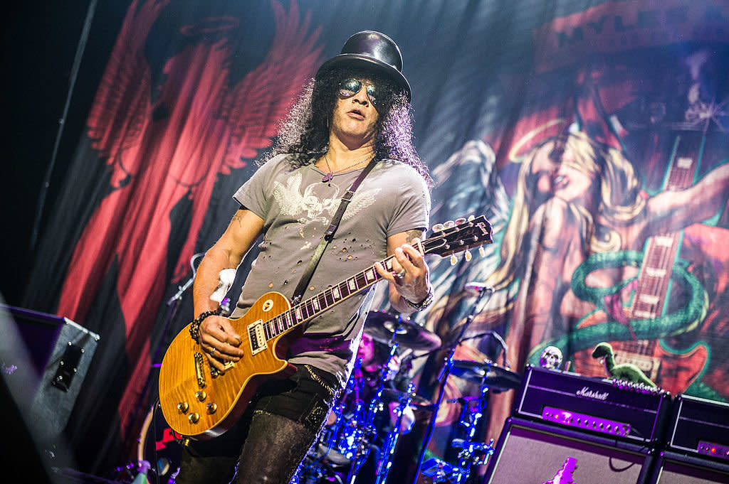 Slash performs wearing one of his signature hats on Oct. 20, 2012, in Paris. (Photo: David Wolff - Patrick/Redferns via Getty Images) 