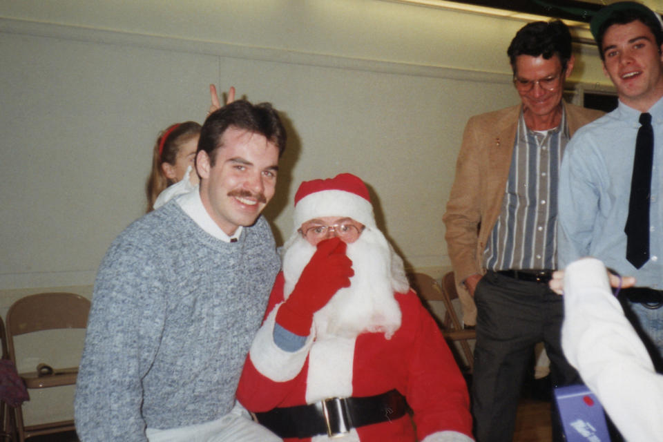 In this Ryan Wasson family photograph, Eric Wasson, left, sits on Santa's lap after receiving a a box of "Santa's Book of Candy," a re-gift from his brother Ryan, during Christmas time 1992, in Chocorua, N.H. Two New Hampshire brothers have gotten their holiday regifting skills down to an art, and have been passing the same hard candy treats back and forth for over 30 years. Starting in 1987, Ryan Wasson gave the treat to his brother Eric Wasson as a joke for Christmas, knowing that Eric wouldn't like it. At far right is Ryan Wasson, with his dad, Dannie Wasson, in jacket. (Ryan Wasson family photograph via AP)