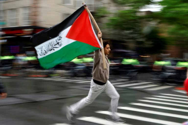 A pro-Palestinian demonstrator runs with a Palestinian flag during a rally in New York earlier this week (John Lamparski)