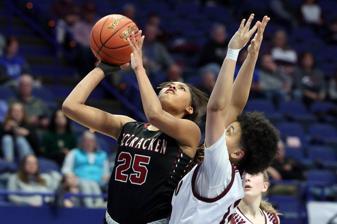 McCracken County’s Destiny Thomas (25) shoots while defended by Ashland Blazer’s Jaidyn Gulley (12). Thomas finished with 10 points, four rebounds, six assists, three blocks and three steals.