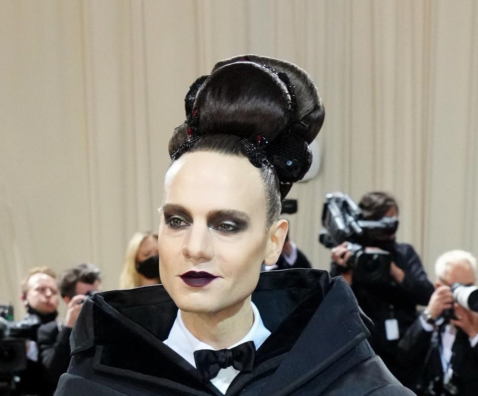 Jordan Roth with goth makeup and a big updo