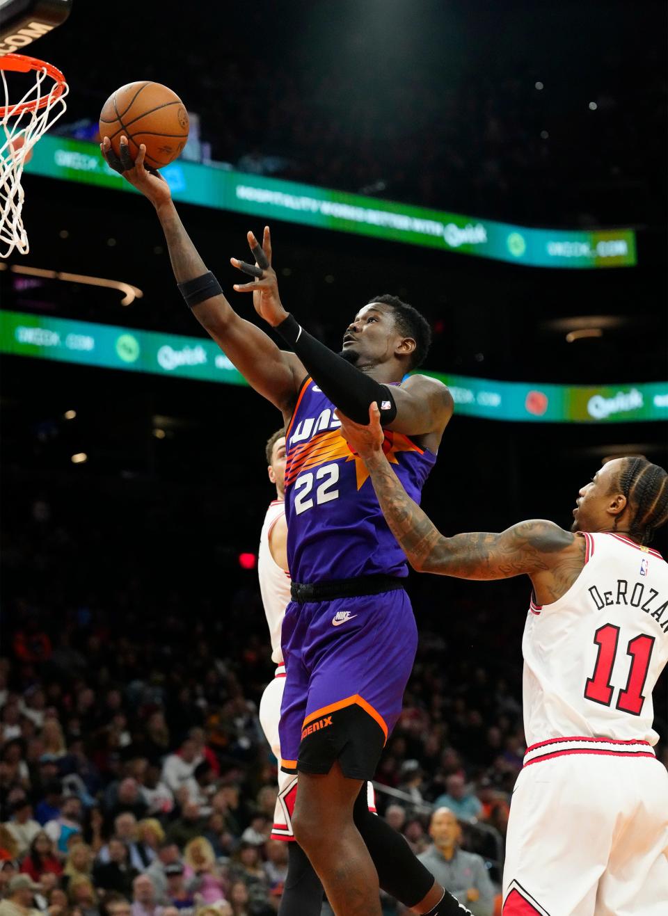 Nov 30, 2022; Phoenix, AZ, USA; Phoenix Suns center Deandre Ayton (22) scores past Chicago Bulls forward DeMar DeRozan (11) in the second half at Footprint Center.