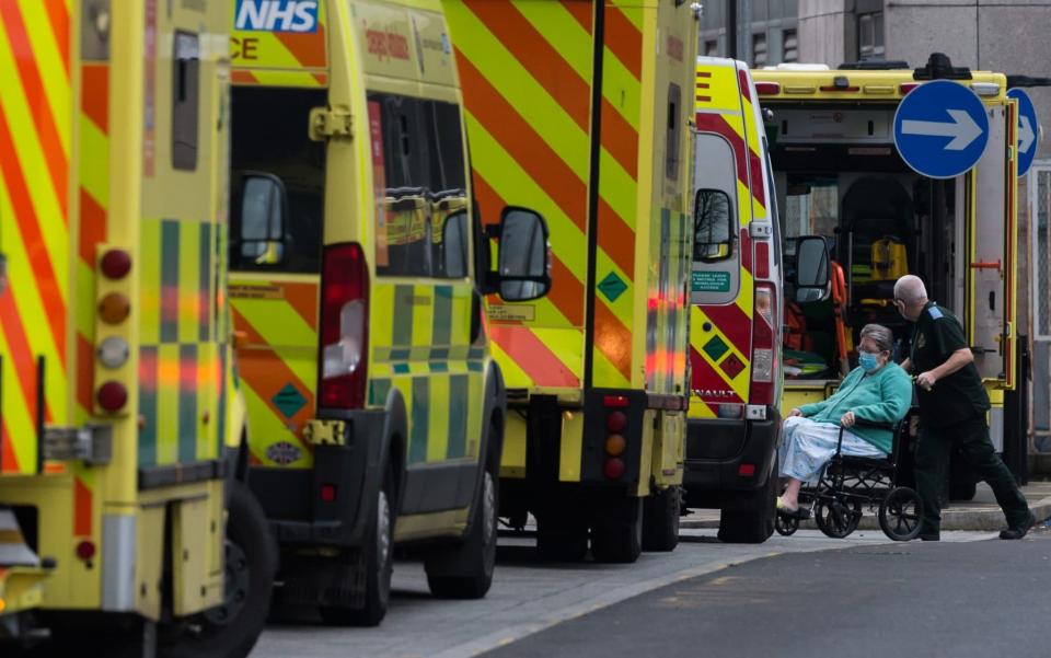 LONDON, UNITED KINGDOM - FEBRUARY 01, 2021: A medic transports a patient from the ambulance to the emergency department at the Royal London Hospital on 01 February, 2021 in London, England. The UK's official coronavirus death toll exceeded 100,000 last week with the NHS remaining under pressure as hospitals provide care to more than 34,000 people suffering from Covid-19.- - Wiktor Szymanowicz/Barcroft Studios/Future Publishing