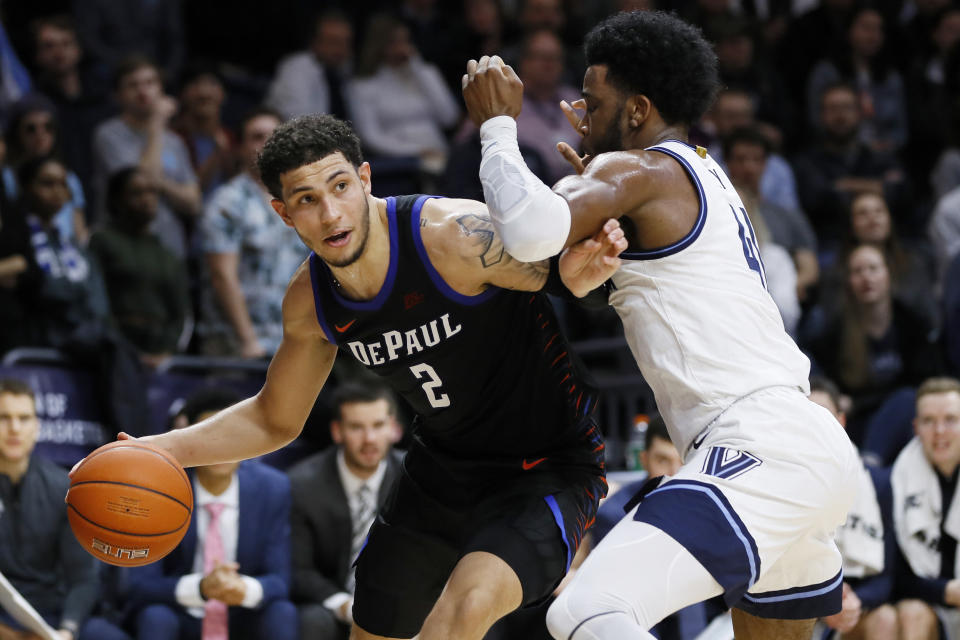 DePaul's Jaylen Butz, left, tries to drive past Villanova's Saddiq Bey during the first half of an NCAA college basketball game, Tuesday, Jan. 14, 2020, in Villanova, Pa. (AP Photo/Matt Slocum)