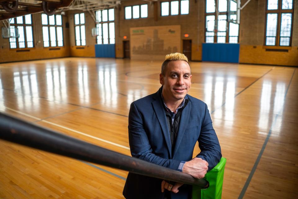 Life Remodeled CEO Chris Lambert stands in the gymnasium at the Durfee Innovation Society building in Detroit on Friday, April 28, 2023, where a prom for grown-ups called Prom Remodeled will be held in multiple areas of the building. The prom will have entertainment by the Montell Jordan and the Gin Blossoms along with DJs and more including food from SheWolf, Baobab Fare and more.