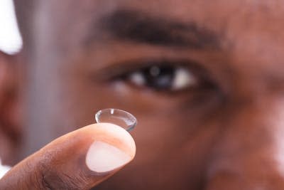 Wearing contact lenses alters the eye microbiome. <a href="https://www.shutterstock.com/image-photo/closeup-man-holding-transparent-contact-lens-1158955207?src=f2U_tCZrEbOxCzeCaCz0yQ-1-0&studio=1" rel="nofollow noopener" target="_blank" data-ylk="slk:Andrey_Popov/Shutterstock.com;elm:context_link;itc:0;sec:content-canvas" class="link ">Andrey_Popov/Shutterstock.com</a>