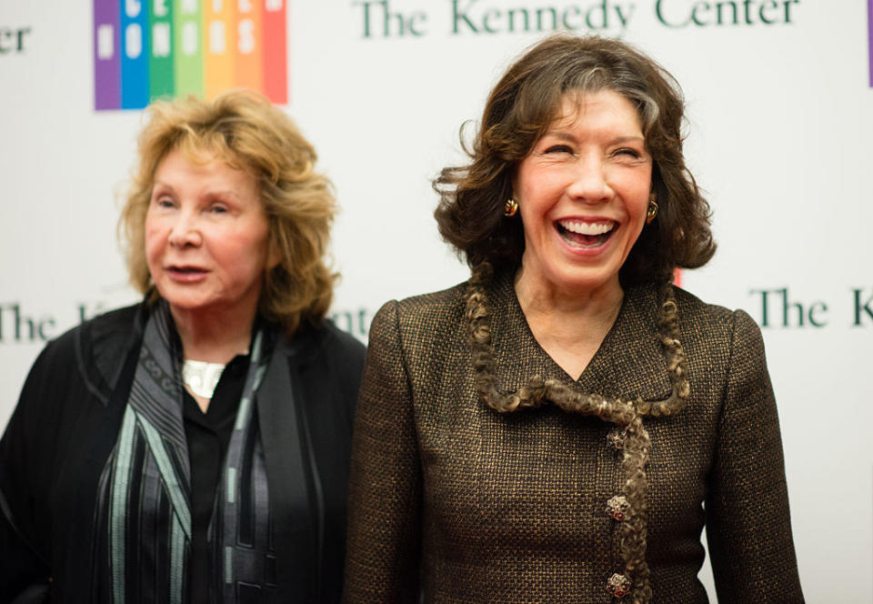 Jane and Lily smiling on a red carpet