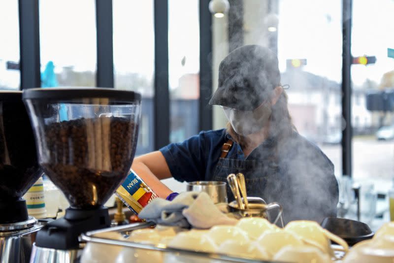 FILE PHOTO: A barista makes coffee for a customer in Houston