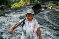 Emerald seeker Blanca Biutrago, a 52-year-old mother of five, hunts for the green gems to support her family