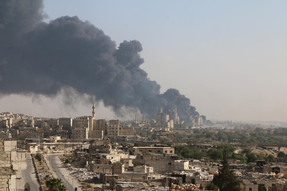 A general view shows rising smoke from a Syrian regime controlled cement factory, in Aleppo, Syria on Aug. 9, 2016.