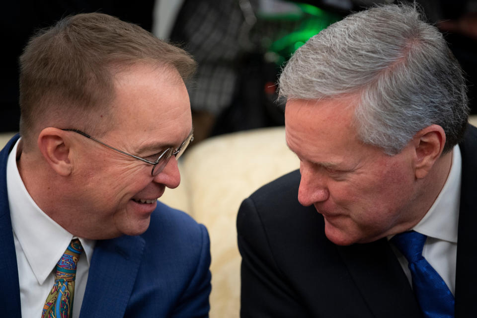 Rep. Mark Meadows (R-N.C.), seen here with outgoing White House chief of staff Mick Mulvaney (left), also had contact with the same person as Collins and Gaetz. Meadows, who is replacing Mulvaney, briefly self-quarantined but tested negative for coronavirus. (Photo: BRENDAN SMIALOWSKI via Getty Images)