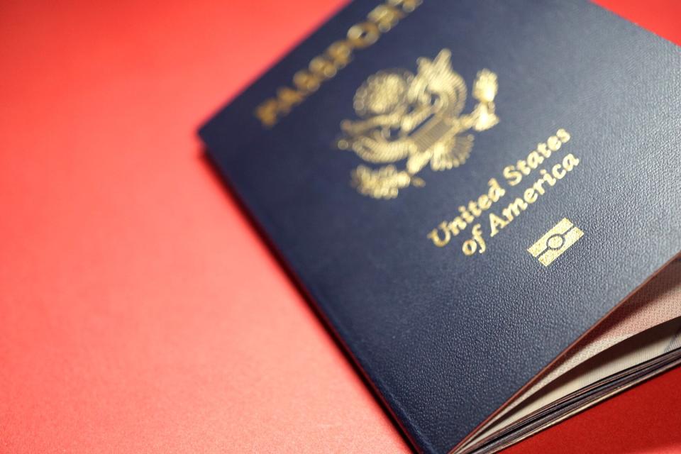 United States Passport on red tabletop