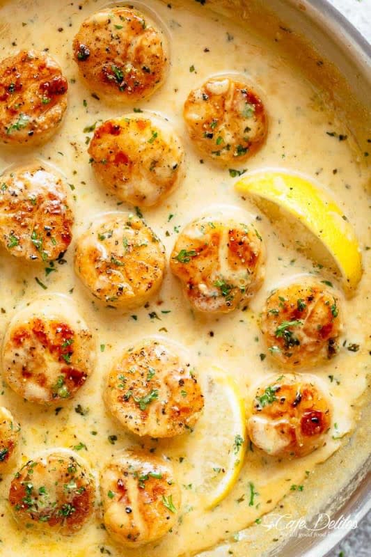 <p>Café Delites</p><p>These creamy garlic scallops are just as good as restaurant scallops with minimal ingredients and maximum flavor!</p><p><strong>Get the recipe: <a href="https://cafedelites.com/creamy-garlic-scallops/" rel="nofollow noopener" target="_blank" data-ylk="slk:Creamy Garlic Scallops;elm:context_link;itc:0;sec:content-canvas" class="link rapid-noclick-resp">Creamy Garlic Scallops</a></strong></p><p><strong>Related: 23 <a href="https://parade.com/1195496/felicialim/fish-and-seafood-burger-recipes/" rel="nofollow noopener" target="_blank" data-ylk="slk:Savory Seafood Burgers When You Need a Meat Break;elm:context_link;itc:0;sec:content-canvas" class="link rapid-noclick-resp">Savory Seafood Burgers When You Need a Meat Break</a></strong></p>