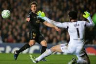 Chelsea's Czech goalkeeper Petr Cech (R) stops a strike from Barcelona's Spanish midfielder Cesc Fabregas (L) during the UEFA Champions League semi-final first leg football match at Stamford Bridge in London. Chelsea won 1-0