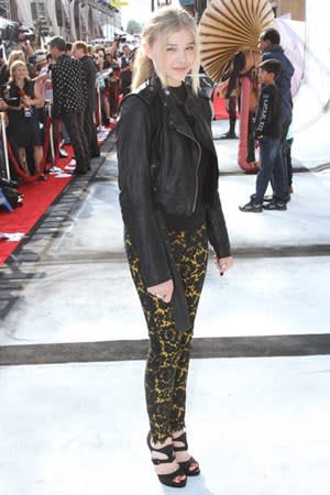 Taking a break from her beloved dresses, she paired an edgy leather jacket with lace leggings for the LA premiere of "Iris." <em>Leggings, Stella McCartney.</em>