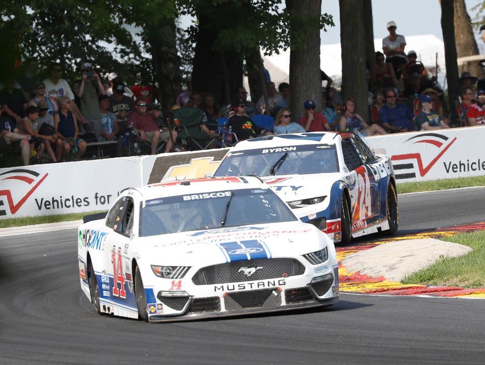 Chase Briscoe leads William Byron through a turn at Road America en route to a sixth-place finish last year.