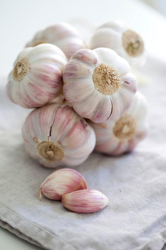 Why You Shouldn't Peel Your Garlic When You Use a Garlic Press