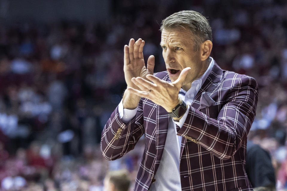 Alabama coach Nate Oats cheers during the first half of the team's NCAA college basketball game against Auburn, Wednesday, March 1, 2023, in Tuscaloosa, Ala. (AP Photo/Vasha Hunt)