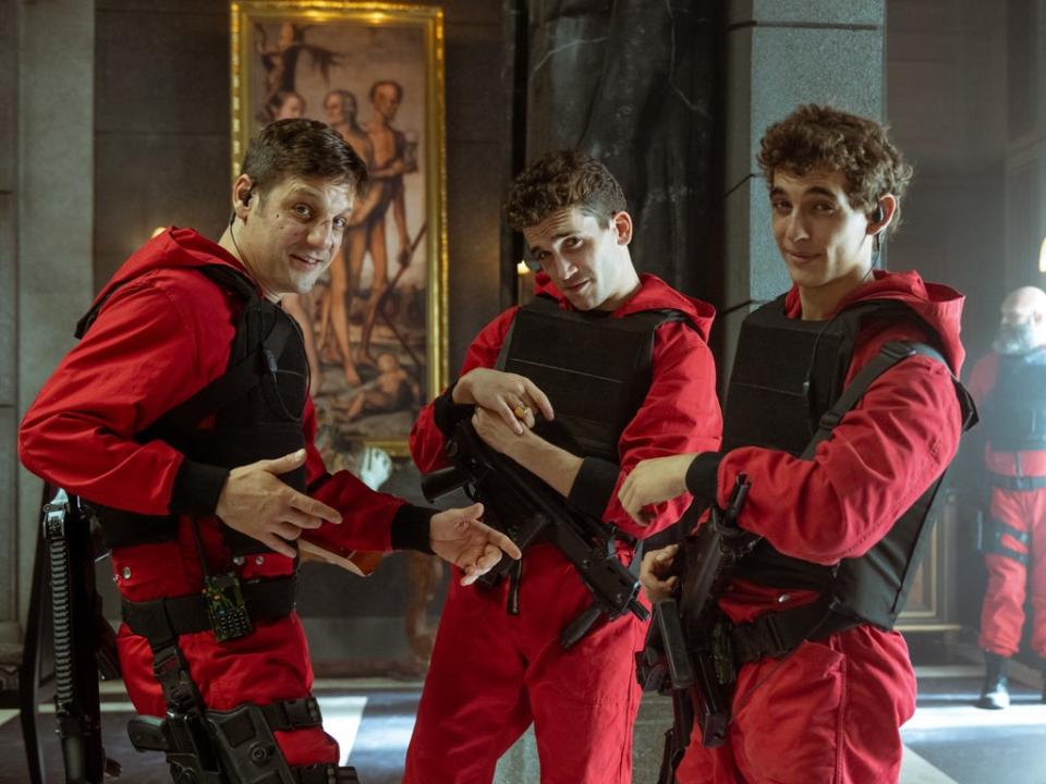 Red jumpsuits plus machine guns equals TV gold: Rodrigo de la Serna, Jaime Lorente and Miguel Herran in ‘Money Heist' (TAMARA ARRANZ/NETFLIX)