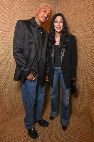 <p>Stephane Cardinale - Corbis/Corbis via Getty</p> Alexander "AE" Edwards and Cher at Balmain during Paris Fashion Week