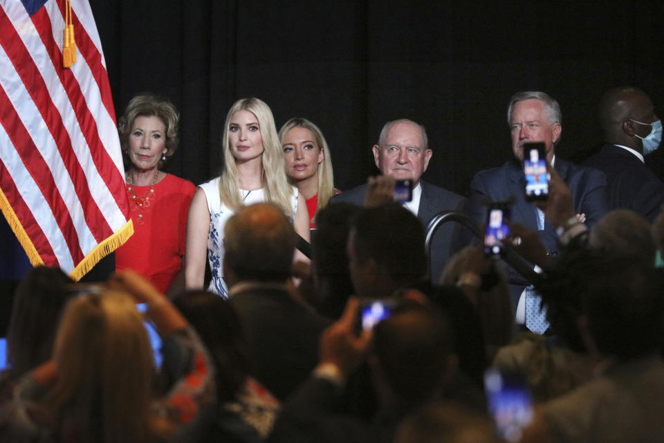 Ivanka Trump, the daughter and senior adviser to the President, second from left, and White House Chief of Staff Mark Meadows, right, and members of the White House staff, listen as President Trump speaks during the first day of the Republican National Convention Monday, Aug. 24, 2020, in Charlotte, N.C. (Travis Dove/The New York Times via AP, Pool)