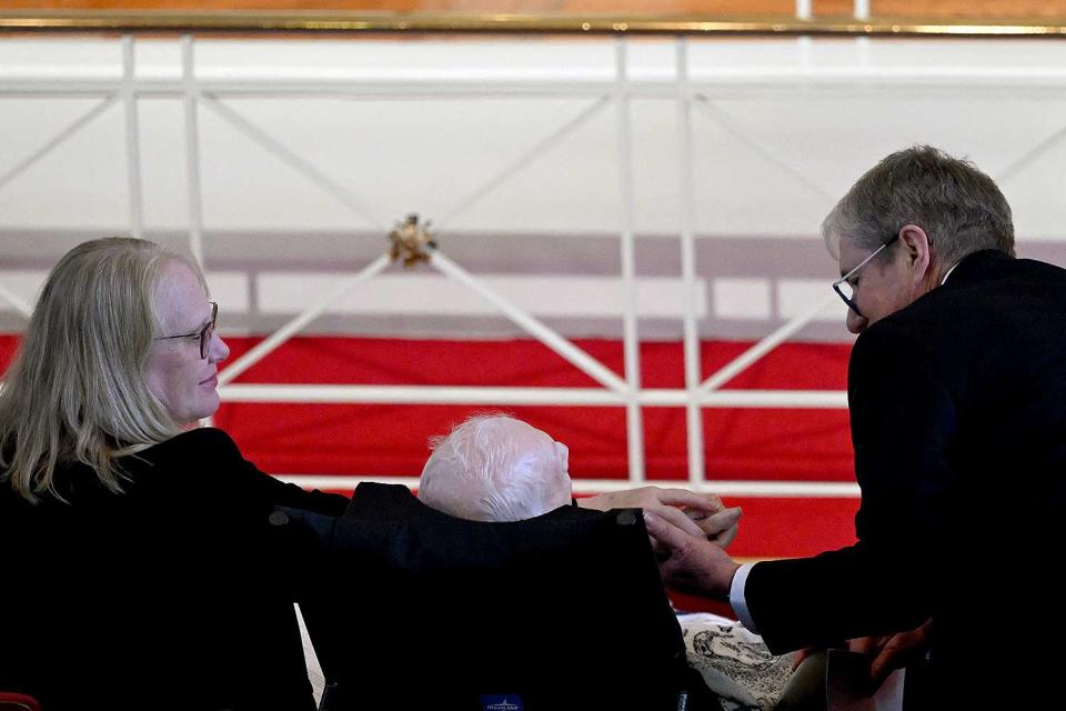 <p>ANDREW CABALLERO-REYNOLDS/AFP via Getty Images</p> James "Chip" Carter and Amy Carter hold hands near their father, former US President Jimmy Carter (C), during a tribute service for former US First Lady Rosalynn Carter, 