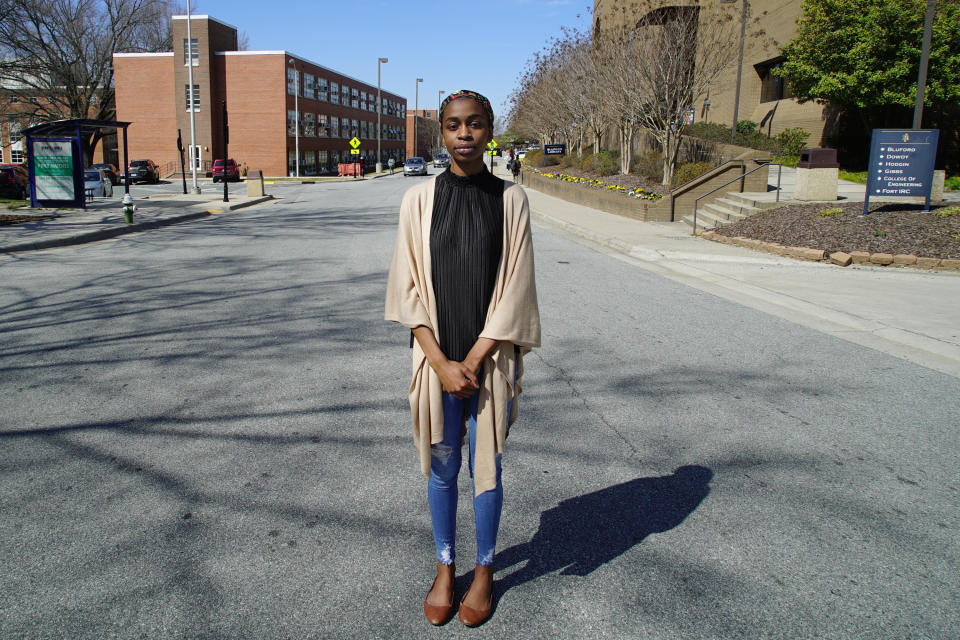 Sophomore political-science major Kylah Guion stands in the middle of Laurel Street in Greensboro, N.C., on Tuesday, March 19, 2019. Gerrymandering has cut the campus of North Carolina A&T University in half, with this street as the dividing line between the 6th Congressional District on her left and the 13th District on her right, both represented by Republicans. “It’s hard to explain to students who are already skeptical about the voting process ... that the state intentionally diluted their power in voting by putting this line back here in between our campus,” she says. (AP Photo/Allen G. Breed)